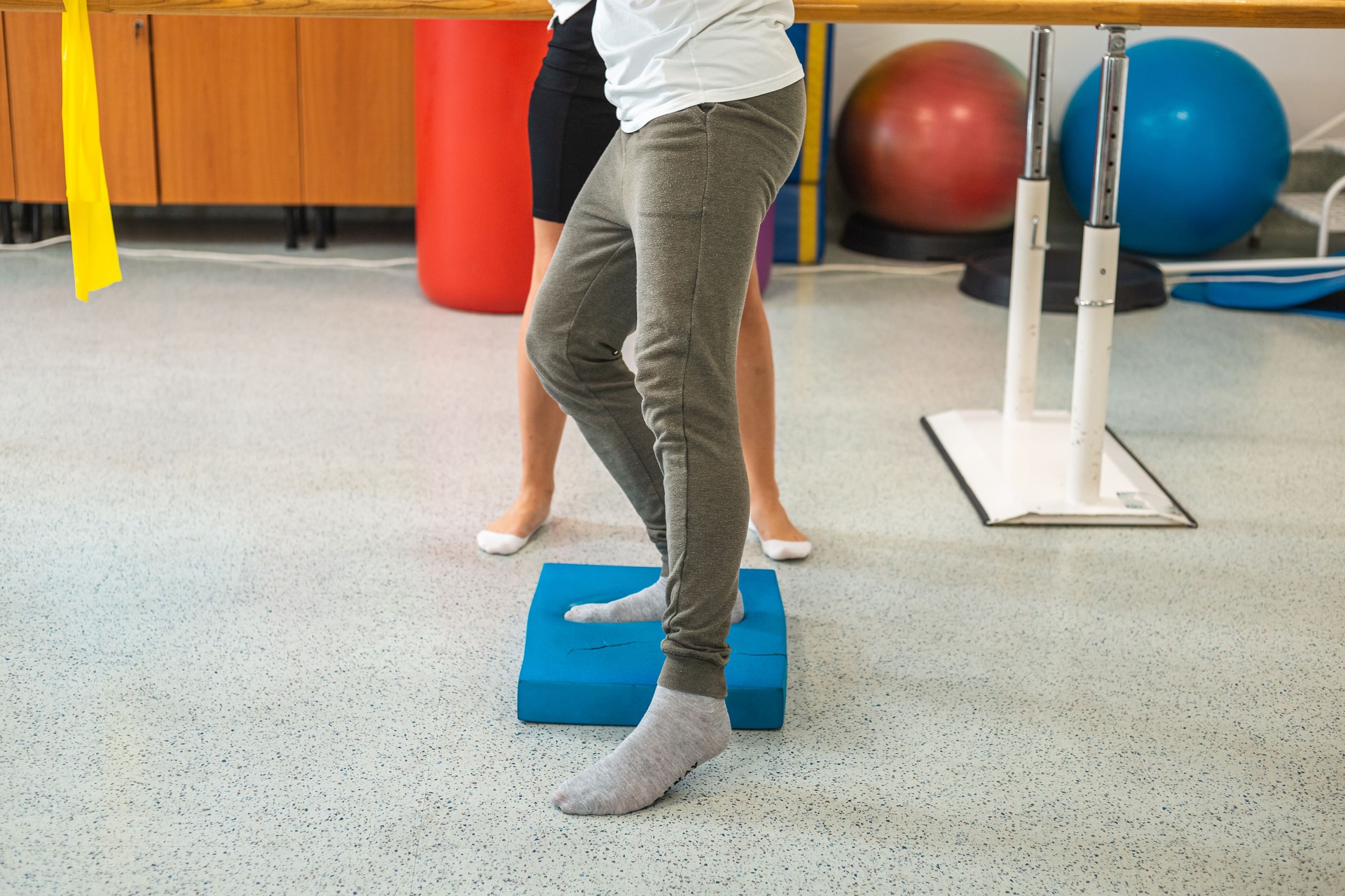 Man doing balance pad exercises