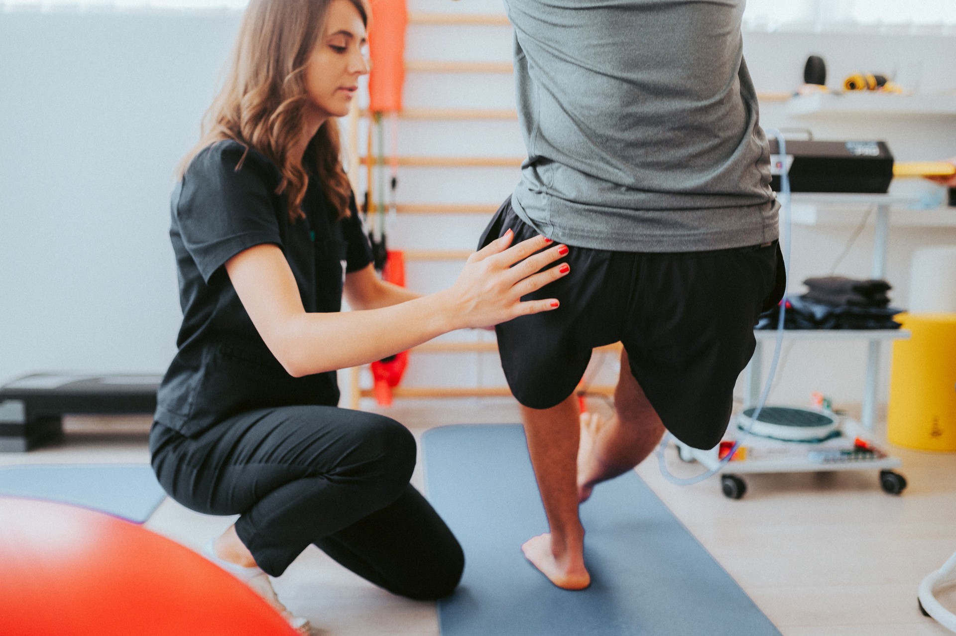 Physiotherapist helps a patient to restore movement